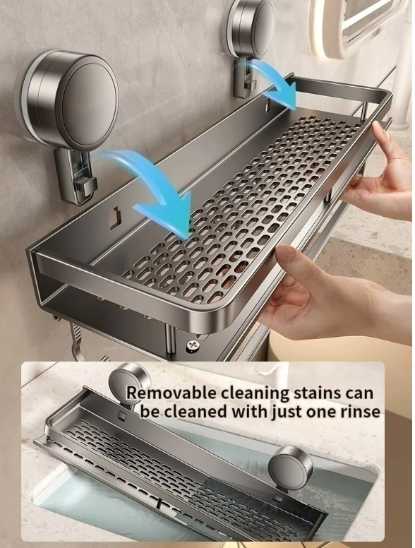 Suction shower caddy mounted on a smooth surface, featuring drainage holes and held by hands.