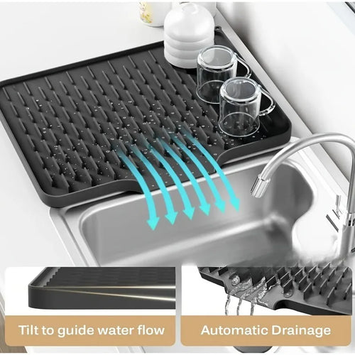 EasyDry Mat in a kitchen setting with glasses drying on its sloped design and integrated drainage spout.