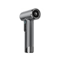 Sleek metallic gray hair dryer with digital display and fan nozzle, designed for wireless charging and portability.