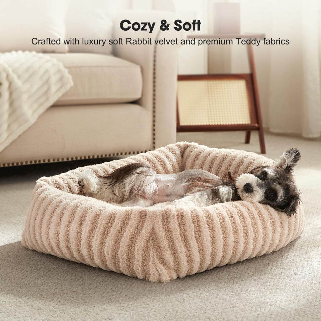 Soft striped dog bed in a cozy indoor setting, featuring a plush round design with a raised edge.