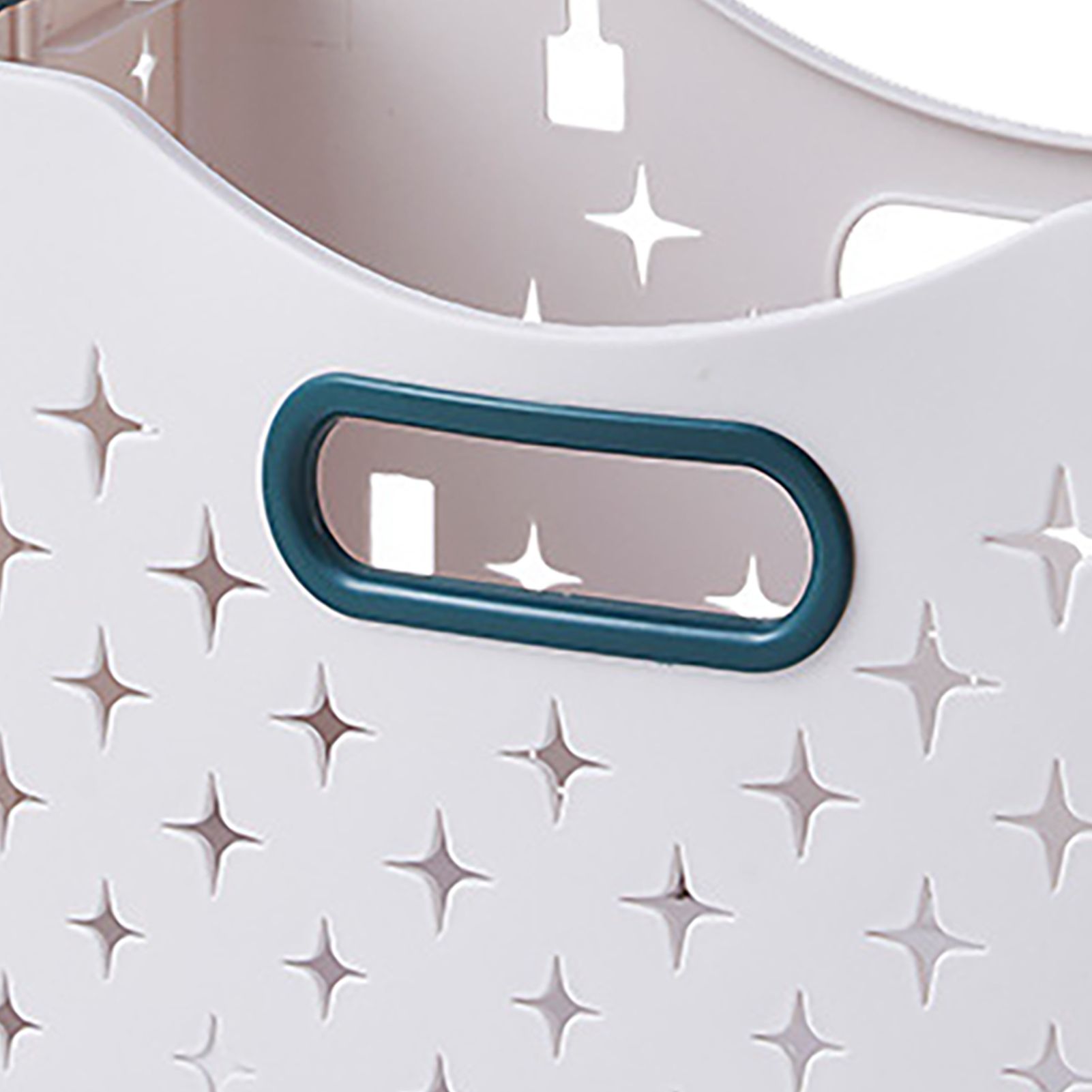 Collapsible laundry basket with ventilation holes and ergonomic handle, featuring a light color and star pattern cutouts.