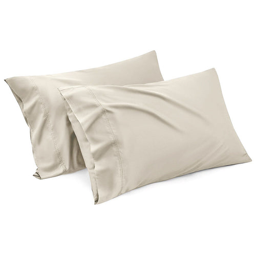 Cream-colored pillowcases with an envelope-style design, fitting standard pillow sizes.